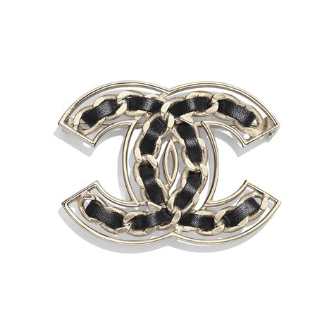 chanel metal and calfskin brooch